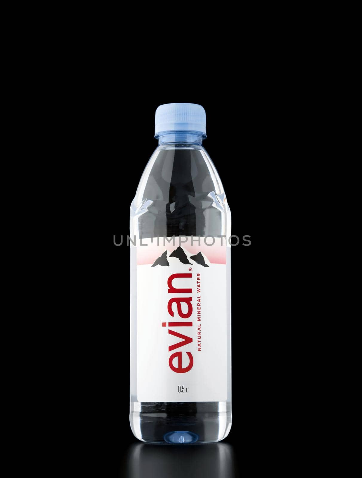 Evian Natural Mineral Water on the black background. Evian is a brand of mineral water coming from several sources near Evian les Bains. 26.12.2021, Rostov region, Russia by EvgeniyQW