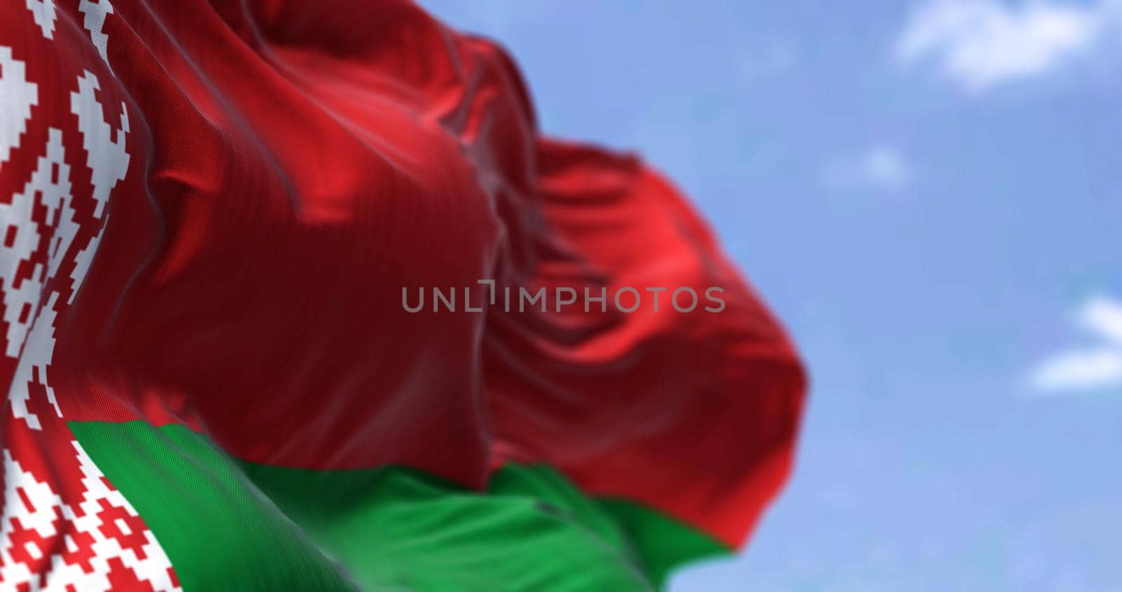 Detail of the national flag of Belarus waving in the wind on a clear day by rarrarorro