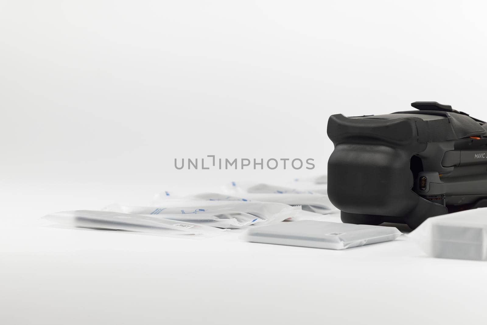 New DJI Mavic 3 drone on a white background when unpacking. Dajiang Innovations Technology Co., Ltd (DJI) world leader developer and manufacturers in UAV. 17.12.2021, Rostov region, Russia.