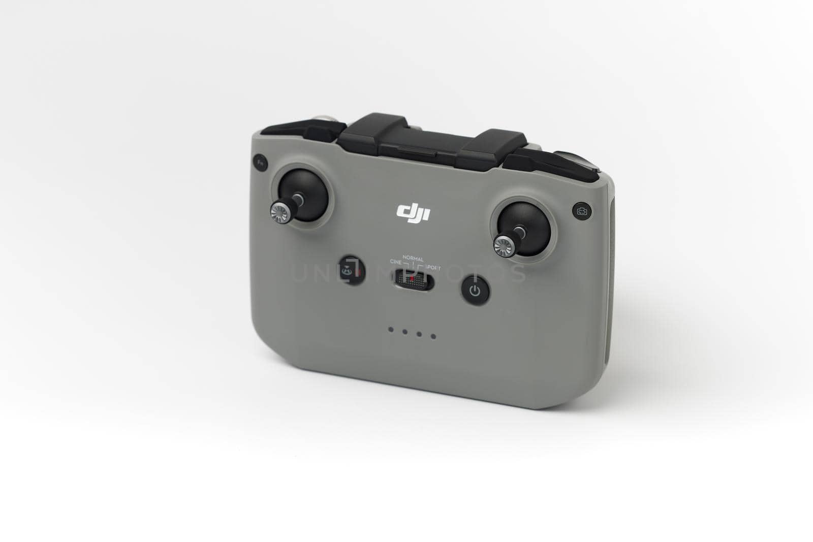 DJI remote control on white background. Control stick of the DJI Mavic 3 drone. Unpacking and configuring the DJI copter. 17.12.2021, Rostov region, Russia.