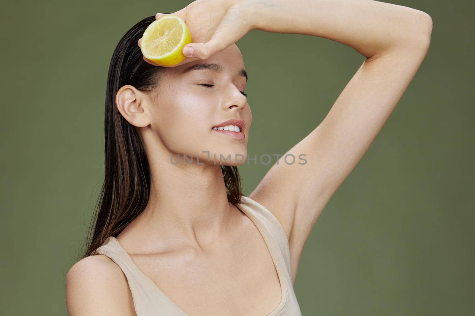 woman eating lemon in hands smile vitamins diet close-up Lifestyle. High quality photo