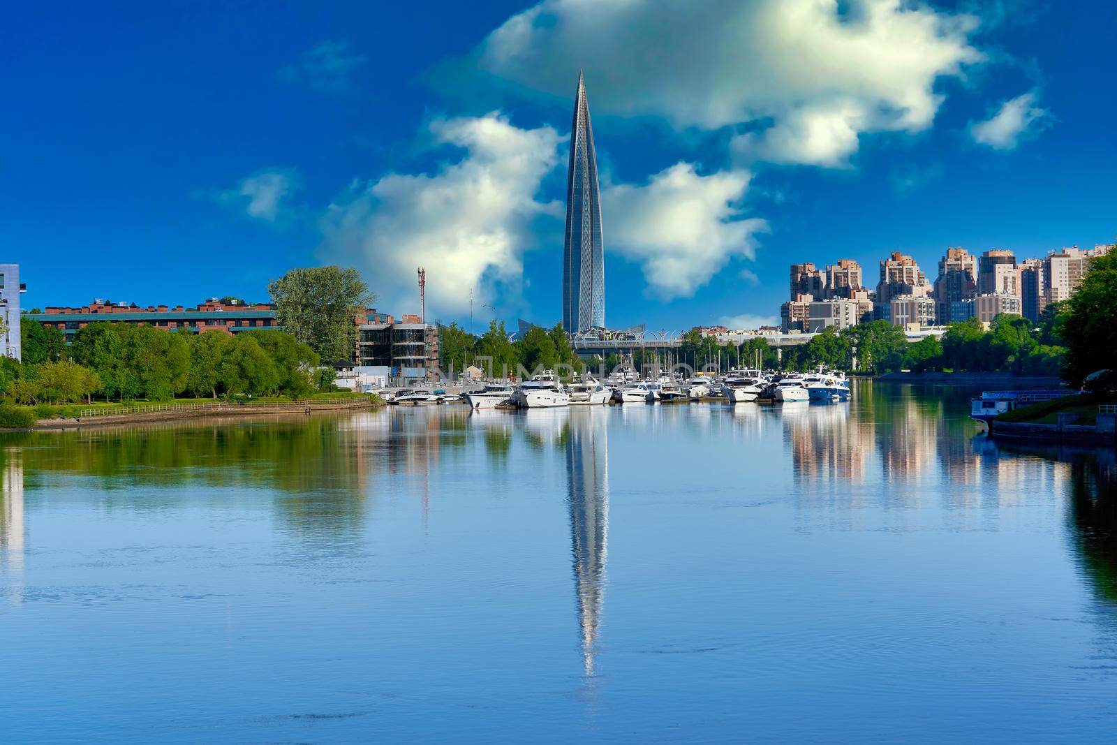 Skyscraper of Gazprom in St. Petersburg with fucking in river against background of a blue sky, cityscape on summer sunny day