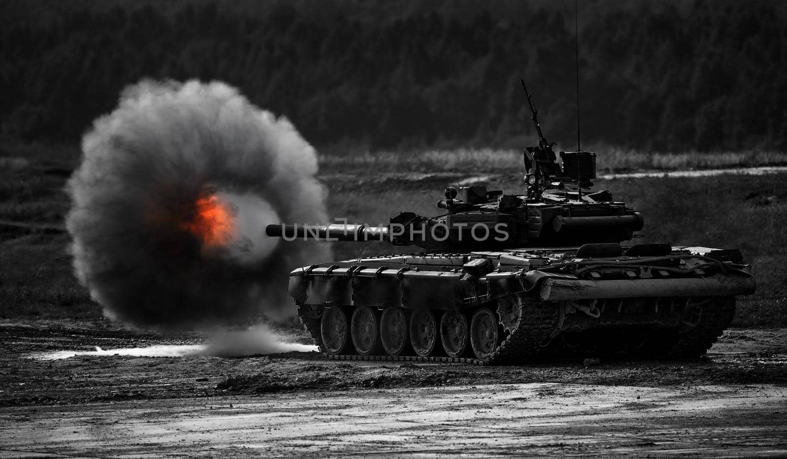 Shot from a tank gun with a smoke ring, the frame of military operations. Russian Modern tank Shooting at a target. Smoke, explosion, military Exercises, Military operations.