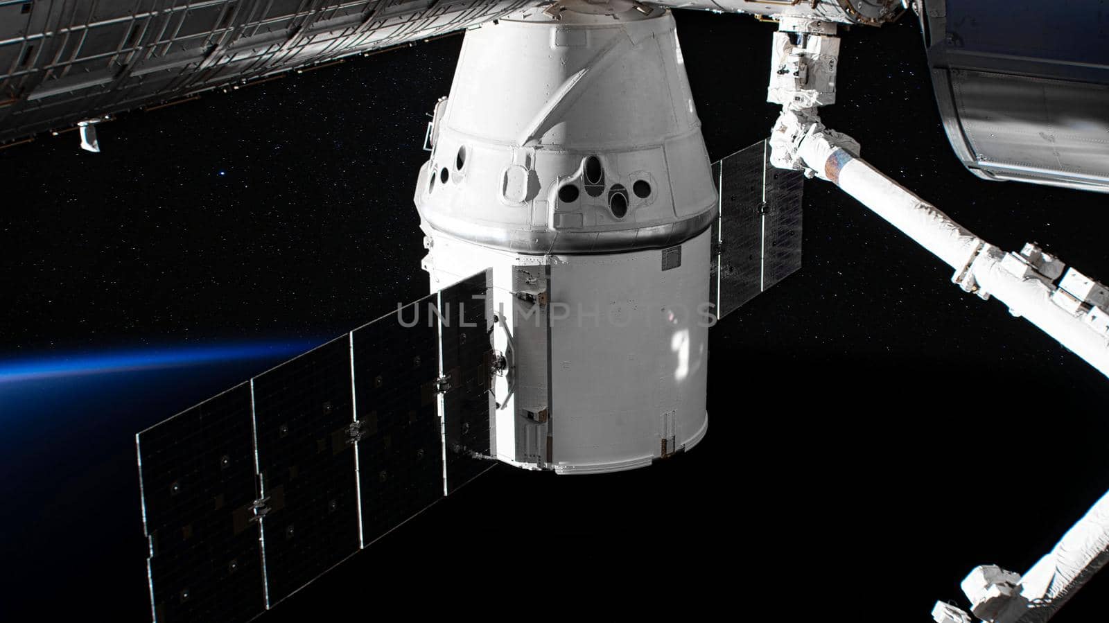 The SpaceX Crew Dragon spacecraft is docked to the International Space Station. Elements of this image furnished by NASA.