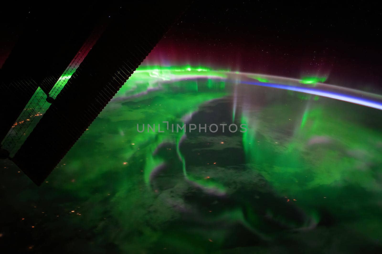 A view of the night earth taken aboard the International Space Station showing an aurora. Disturbances in the magnetosphere caused by solar wind. Element of this image furnished by NASA.