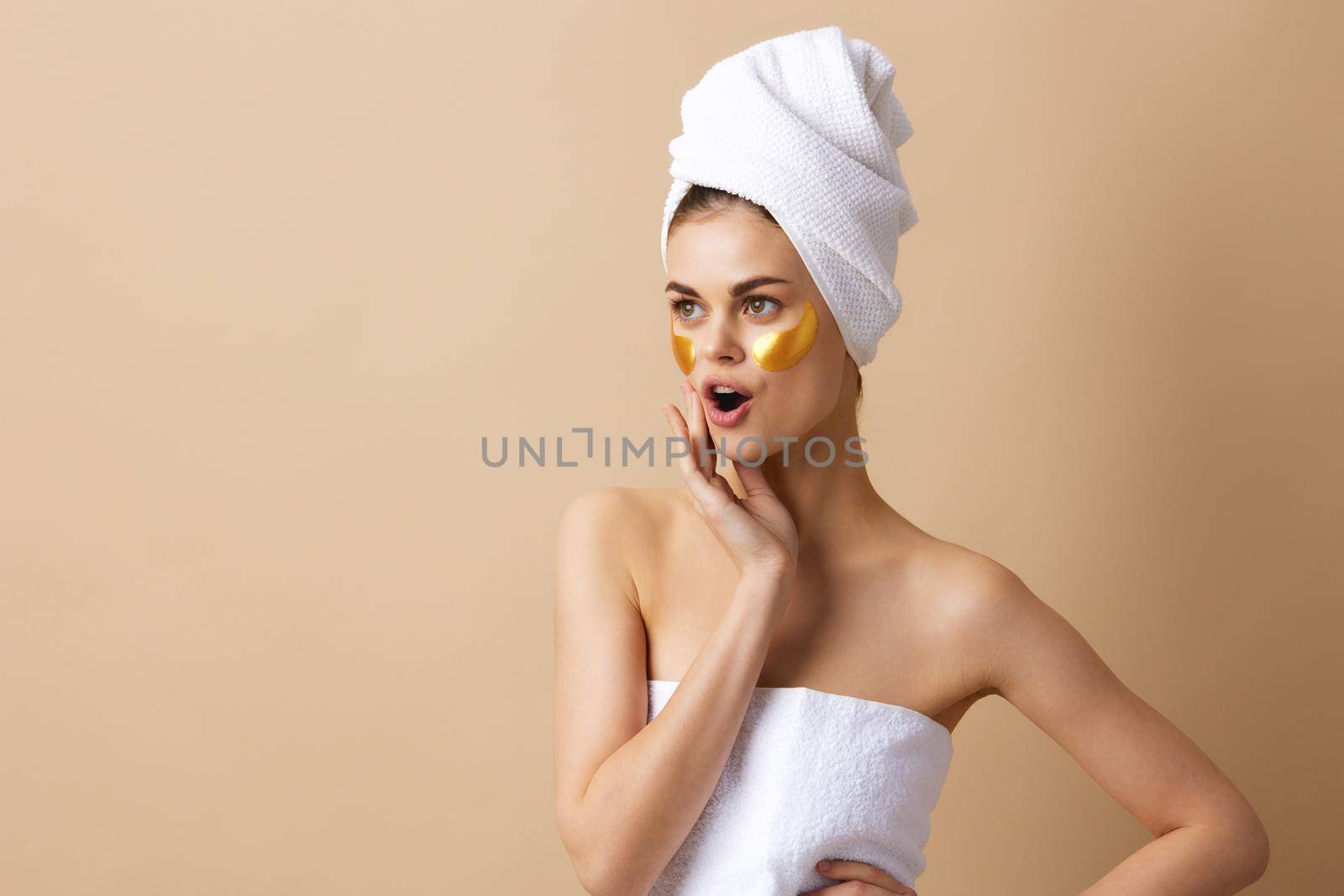 woman with a towel on his head gesturing with his hands skin care close-up Lifestyle by SHOTPRIME