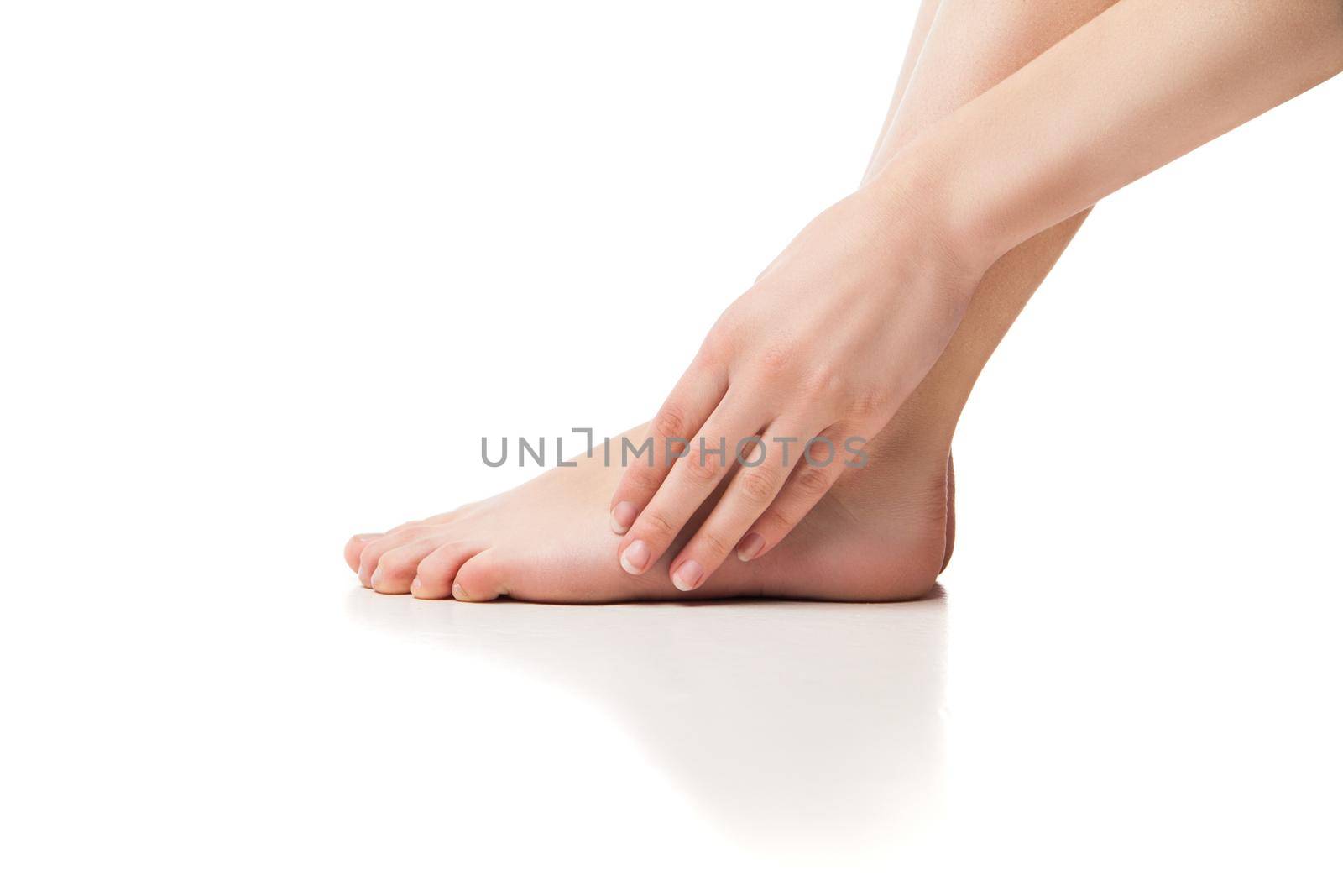 Woman foot on white background, isolated, close-up