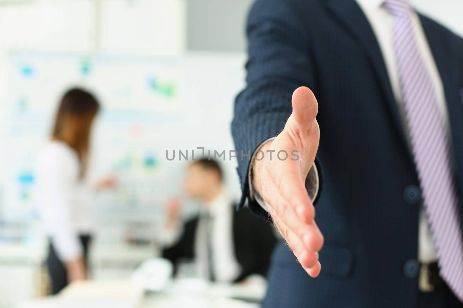 Close-up of person willing to shake hand with you, confirm deal, support decision. Friendly gesture towards agreement member. Contract, deal, agree concept