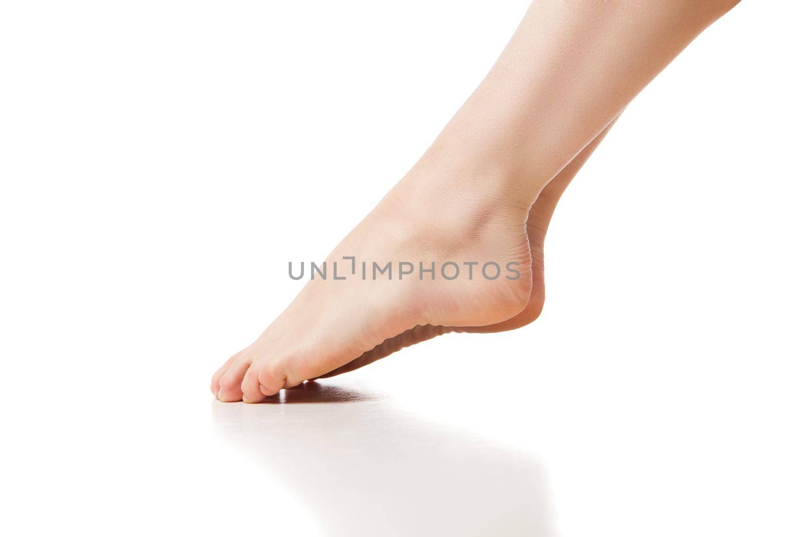 Woman foot on white background by Julenochek