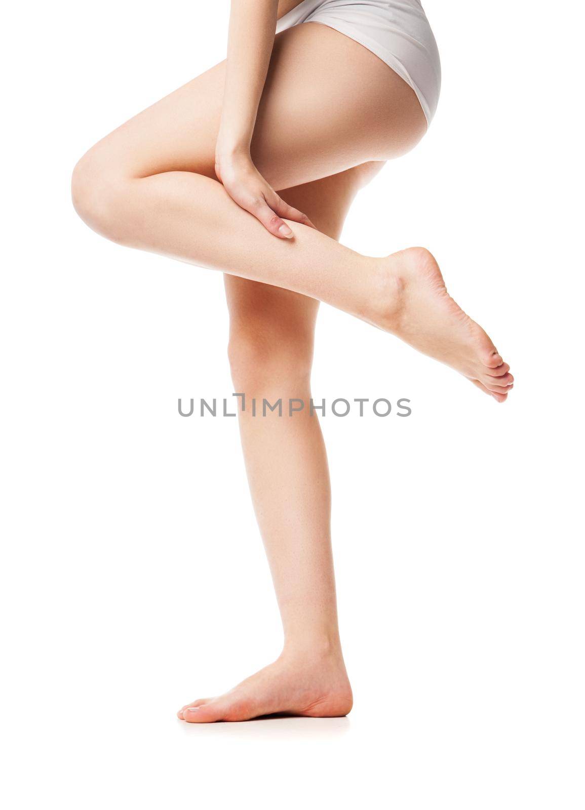 Beautiful wet feet, women legs on white background by Julenochek