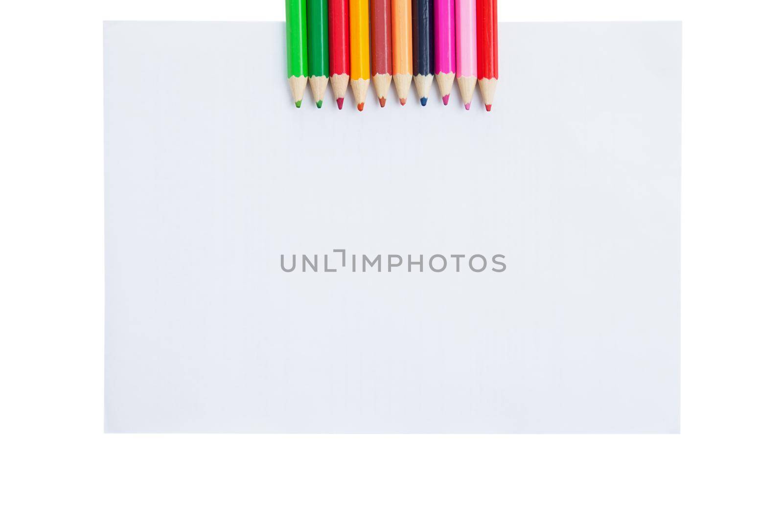 Colour pencils and paper blank isolated on white background by Julenochek