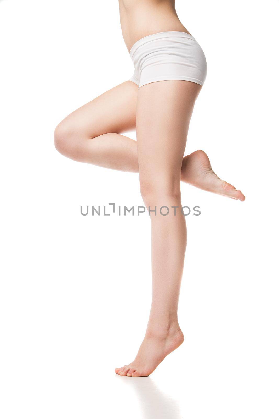 Beautiful wet feet, women legs on a white background by Julenochek