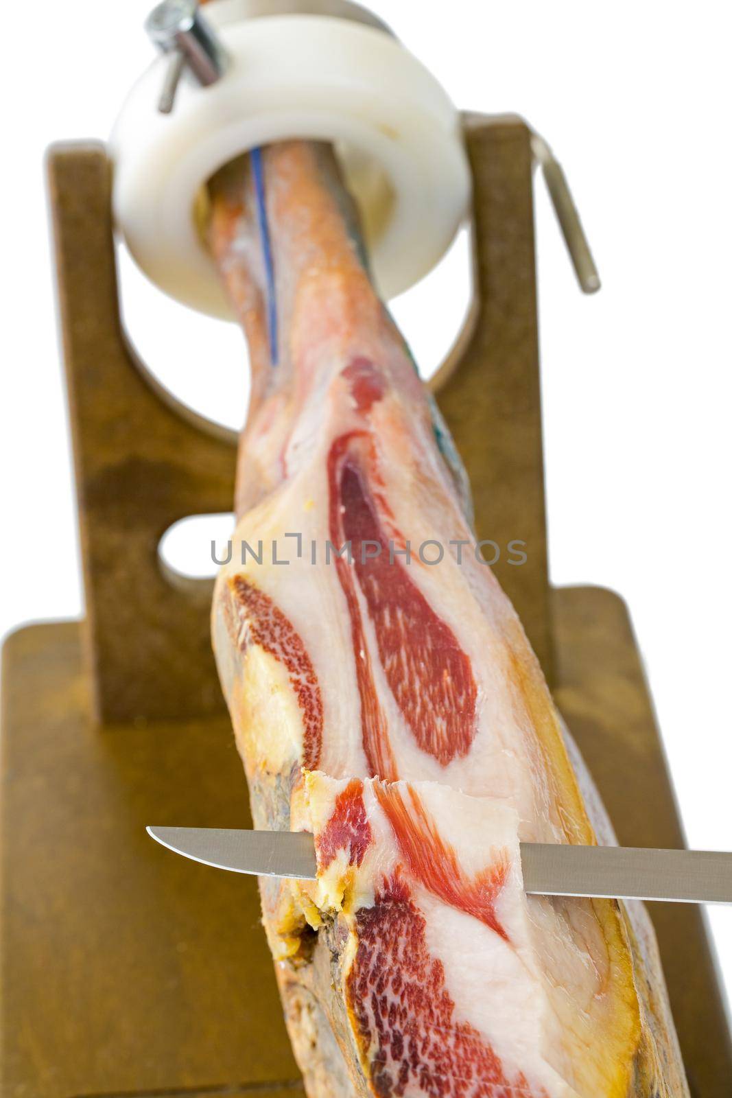 Cutting serrano ham slices