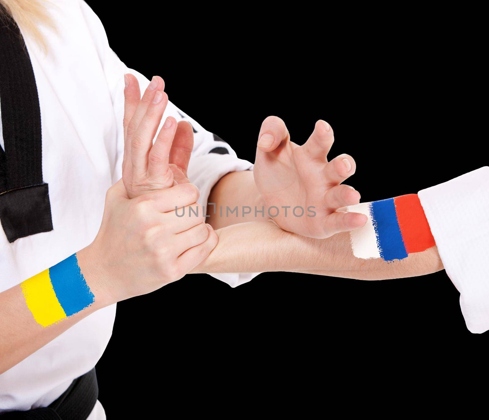 Power takeover Ukraine and Russia two fighting hands of representatives of different countries. Hold hands of two fighting people isolated on black background.