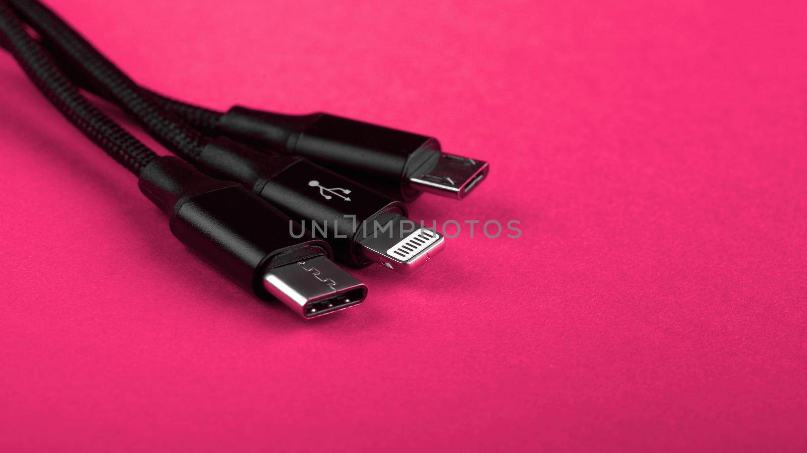 Closeup Shot of Universal USB Cable. 3 different cellphone usb charging plugs adapter from USB by EvgeniyQW