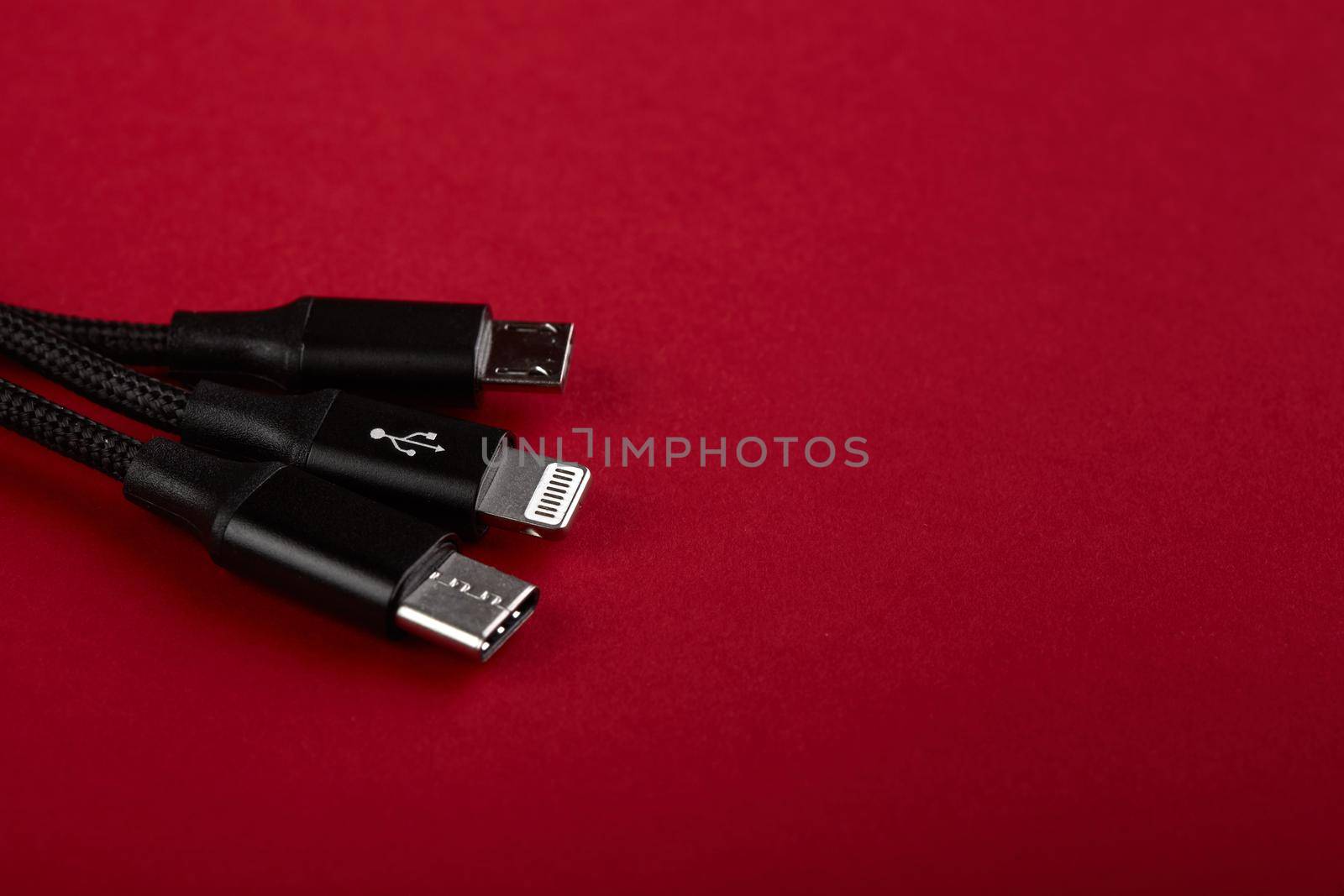 Closeup Shot of Universal USB Cable. 3 different cellphone usb charging plugs adapter from USB