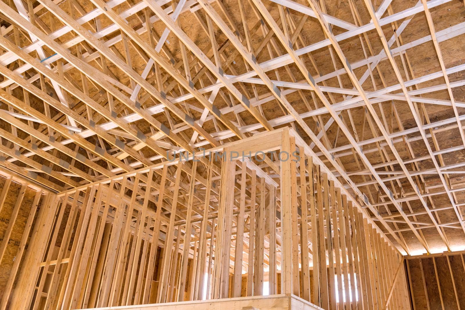 Wooden beams the roof of a private house without unfinishing inside a interior view