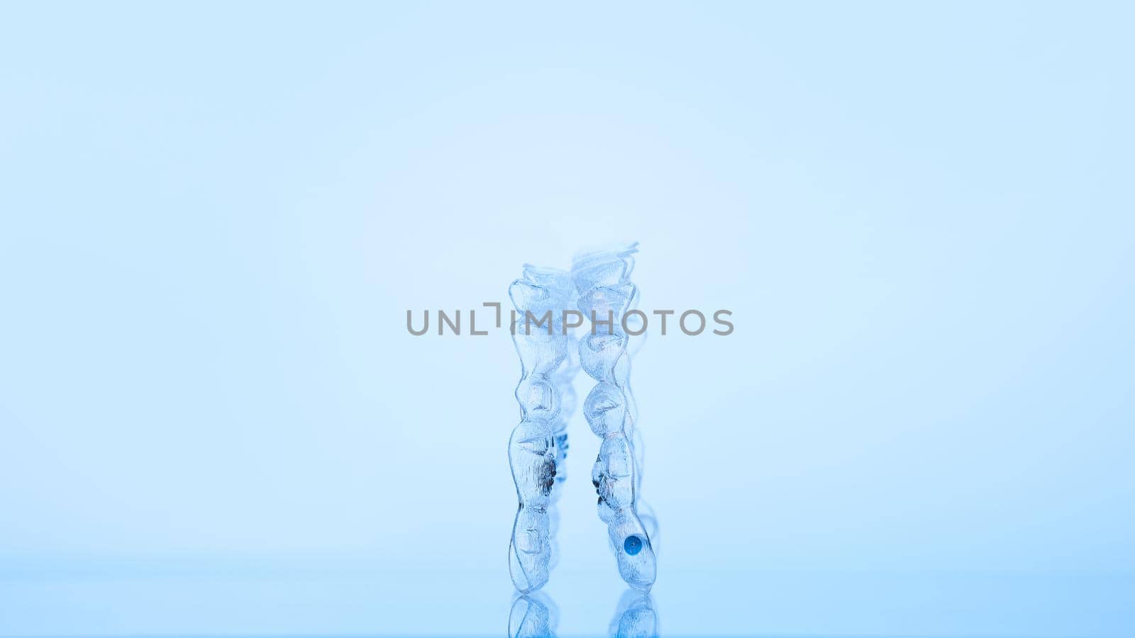 Invisible dental teeth bracket tooth aligners. Invisalign braces. Invisible aligner - Orthodontic temporary removable straighteners.