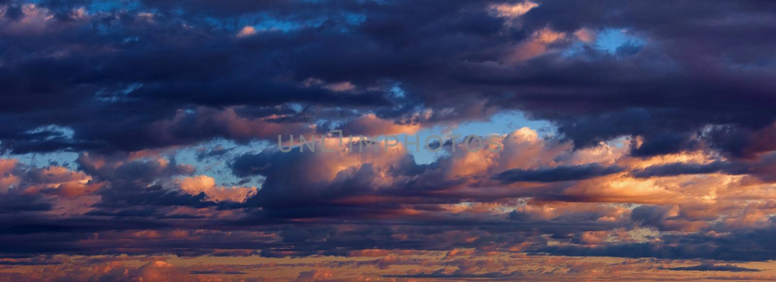 Beautiful Clouds at sunset, panorama of the sky. the colours of the sunset.