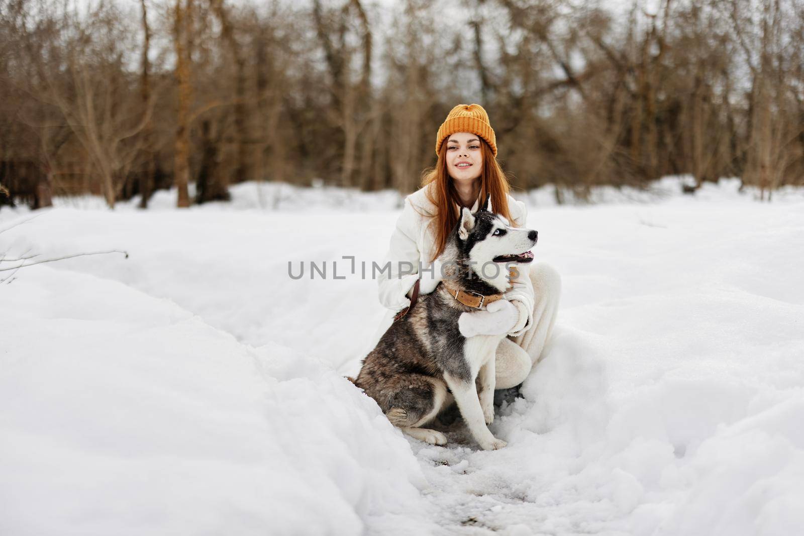 young woman with husky outdoor games snow fun travel Lifestyle by SHOTPRIME