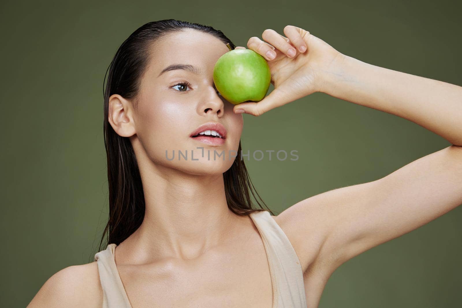 brunette green apple near face health close-up Lifestyle by SHOTPRIME