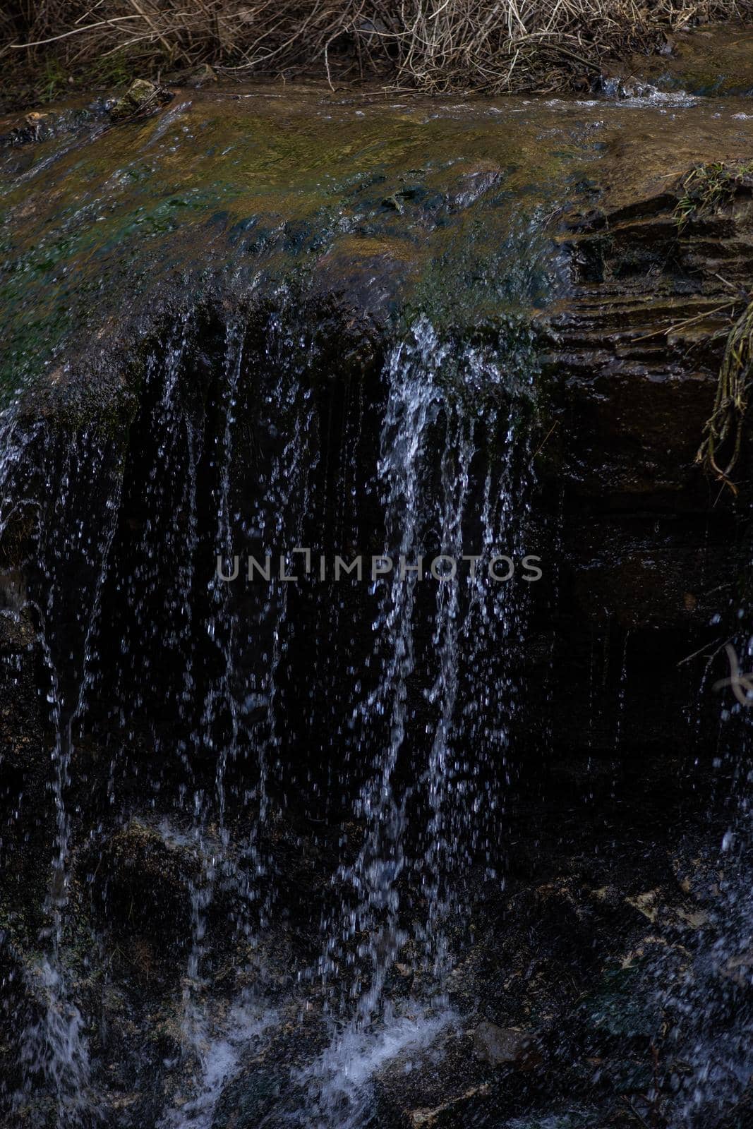 Waterfall in wild area close to georgian capital city Tbilisi in early sping season