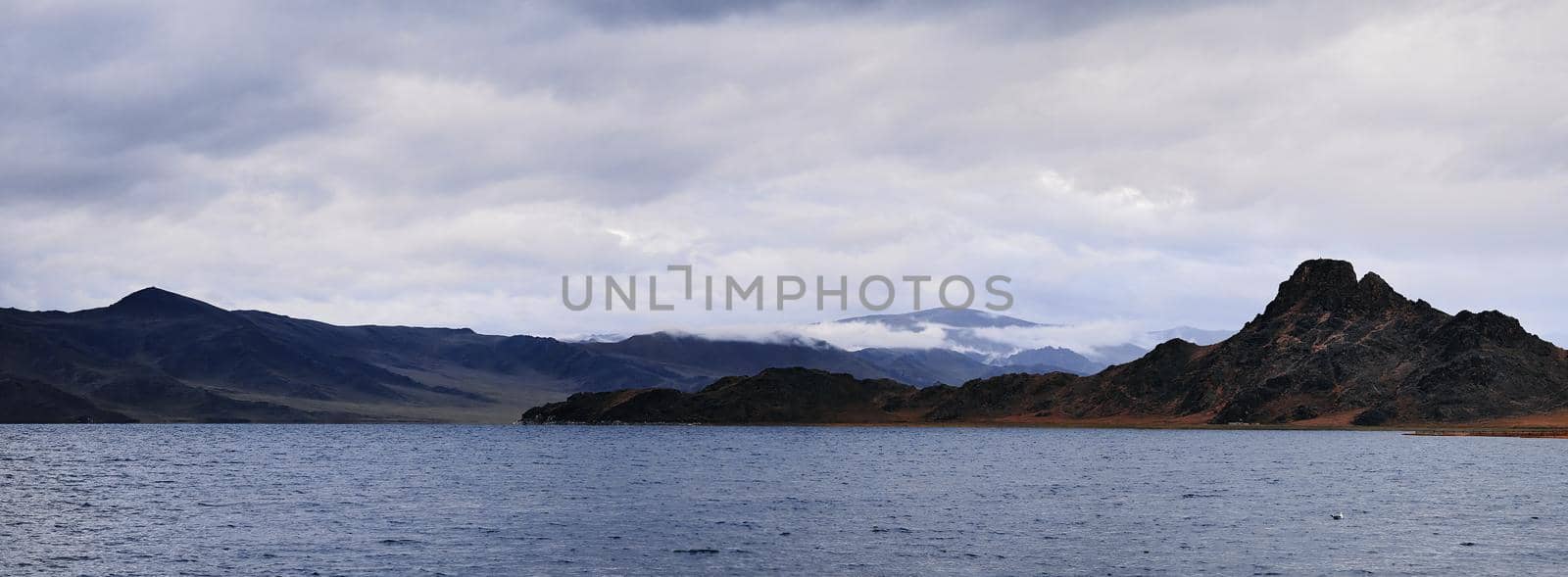 Panorama of a mountain lake. Somewhere in the vastness of Mongolia.