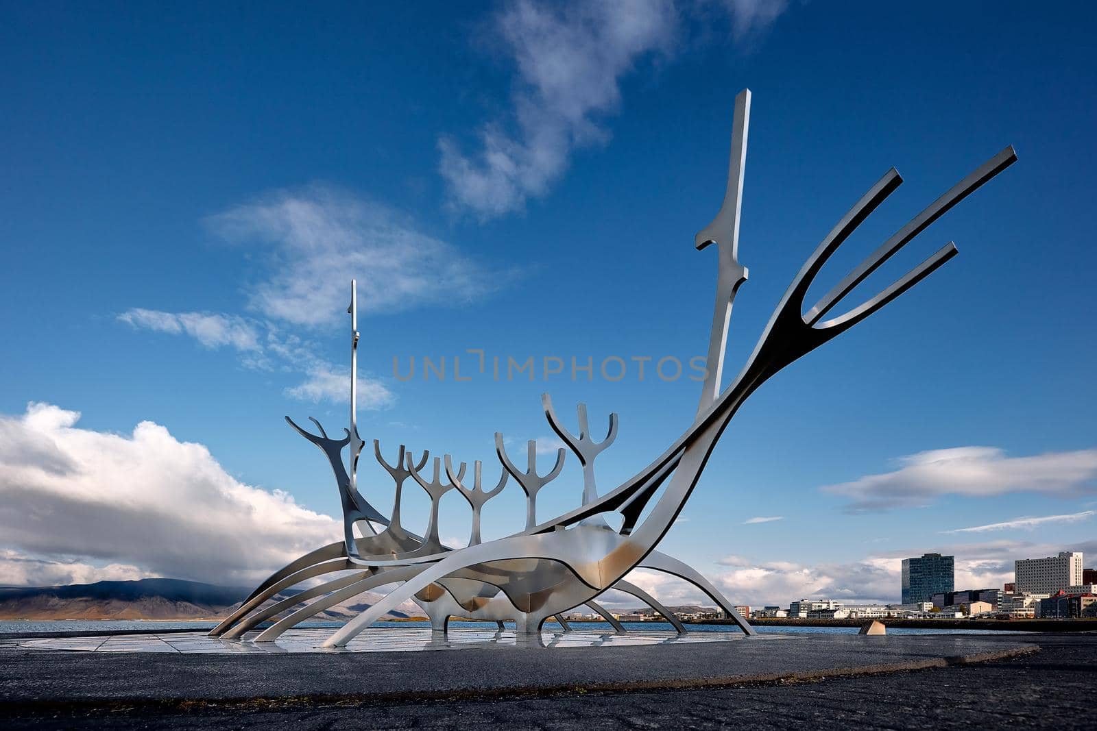 Sun Voyager monument, clouds, landmark of Reykjavik city.