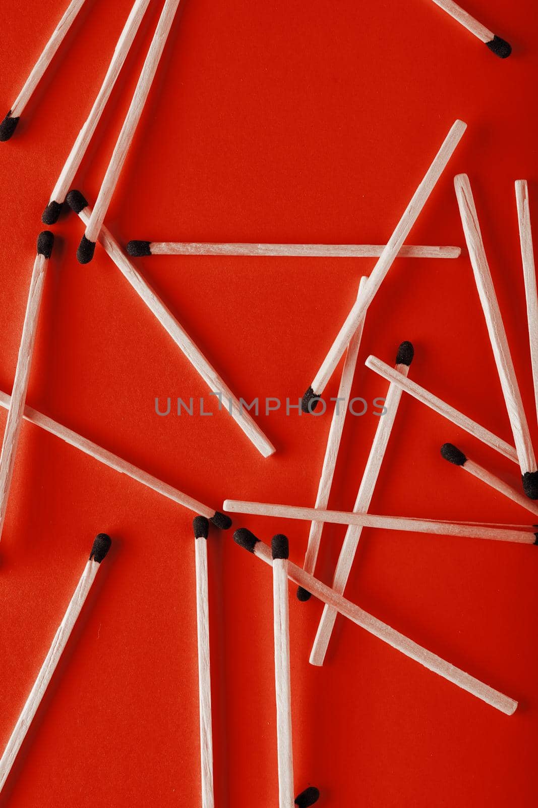 Matches on a red background, an abstraction about teamwork and modern relationships. by EvgeniyQW