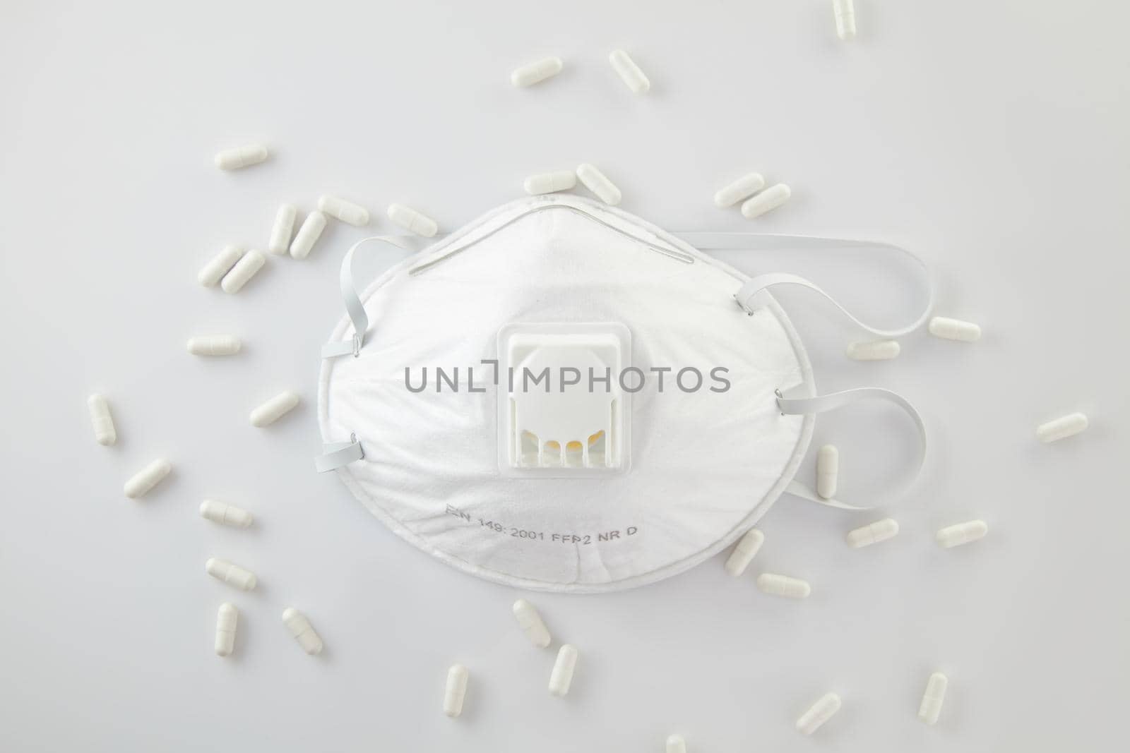 Highly effective respirator. Means of respiratory protection. Protective face mask means of protection against coronavirus infection, pneumonia, and respiratory diseases. medical respirator and pills.