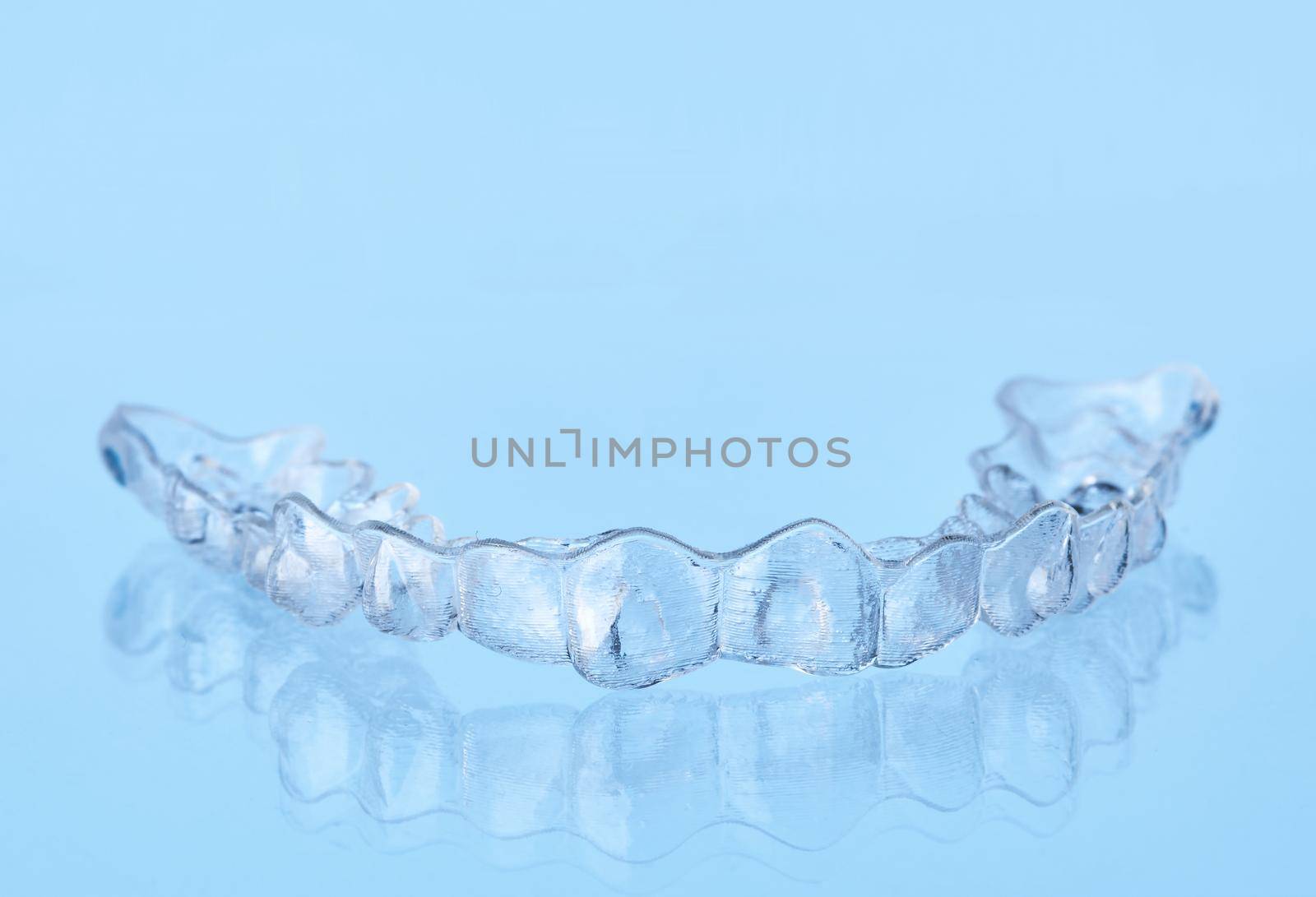 Invisible dental teeth bracket tooth aligners. Invisalign braces. Invisible aligner - Orthodontic temporary removable straighteners.