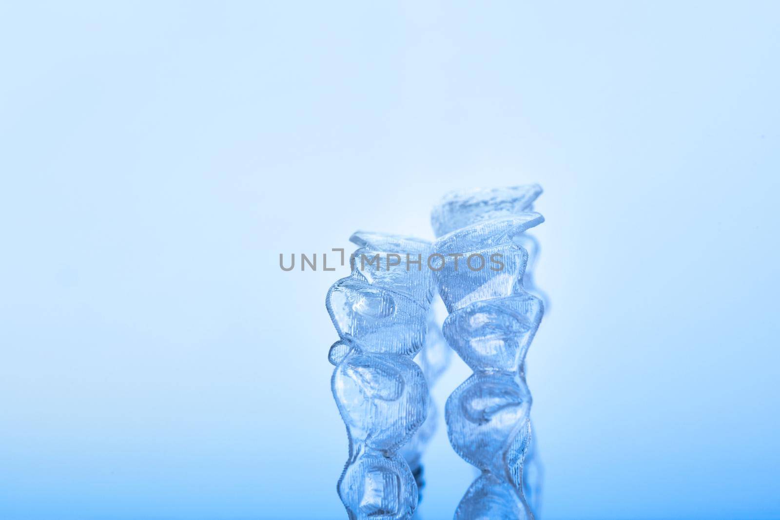 Invisible dental teeth bracket tooth aligners. Invisalign braces. Invisible aligner - Orthodontic temporary removable straighteners.