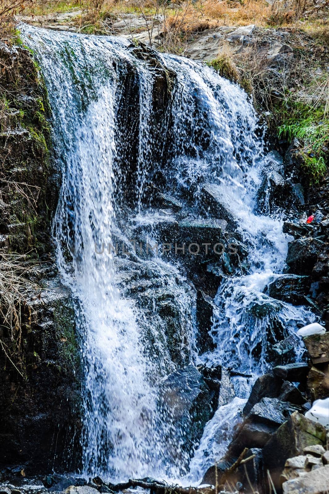 Waterfall in wild area close to georgian capital city Tbilisi in early sping season