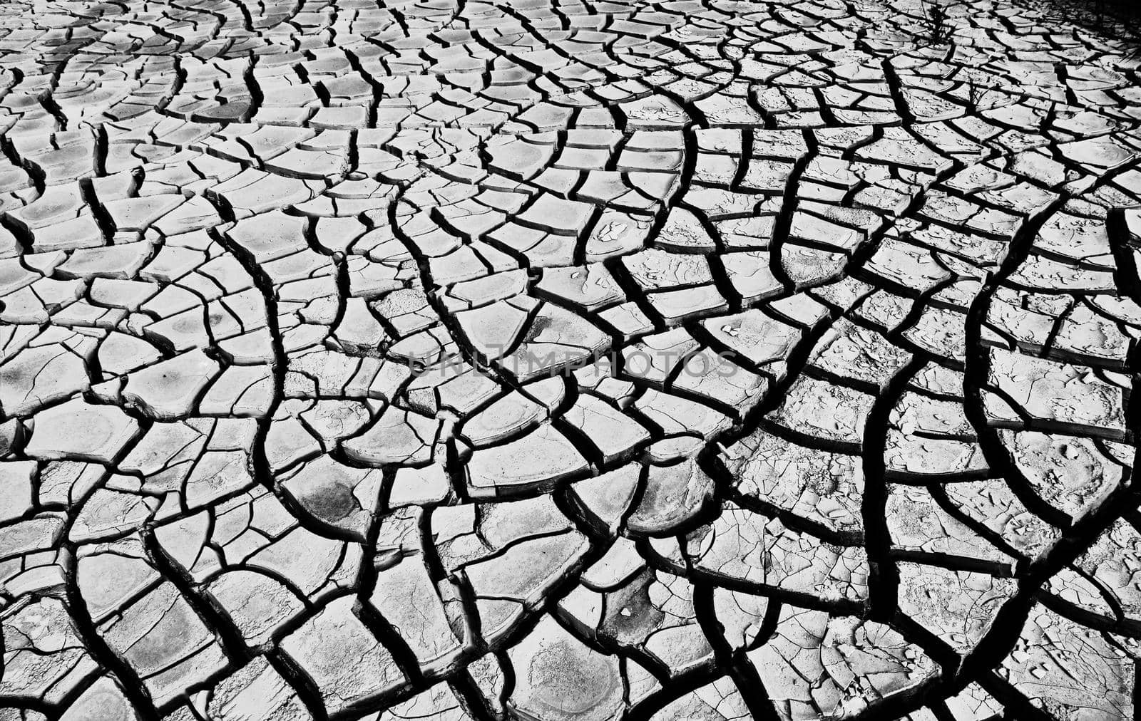 Desert. Aerial view of a beautiful cracks in the ground. texture, deep crack. Effects of heat and drought. effects of global warming. cracked desert landscape.