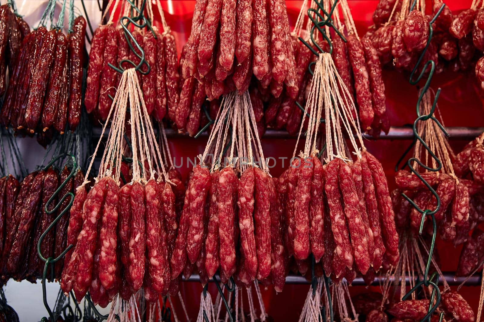 Street trade in Chinatown. Smoked Chinese red sausages. by EvgeniyQW