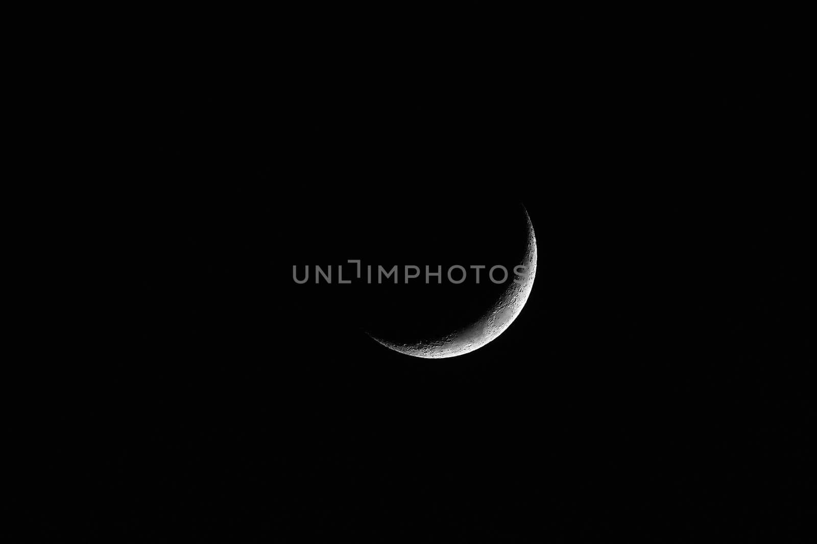 Waxing Crescent. Young moon on black background by EvgeniyQW