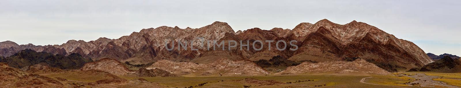 Pasture in the mountains of Mongolia. Landscapes of Mongolia, panorama of mountains in the Gobi desert.