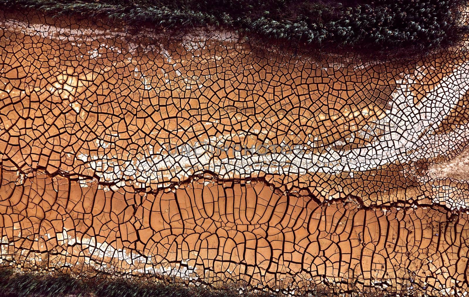 Desert. Aerial view of a beautiful cracks in the ground. texture, deep crack. Effects of heat and drought. effects of global warming. cracked desert landscape. by EvgeniyQW