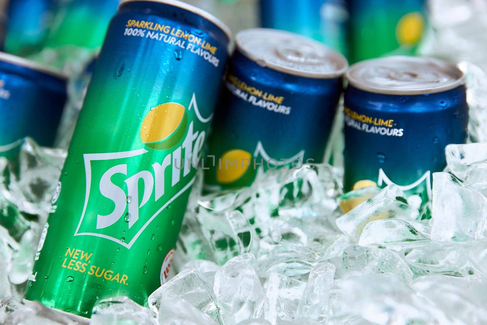 Cold sprite cans on the ice. Brand of soft drink, created by the Coca-Cola Company, Popular soft drink. 18.01.2019 Singapore by EvgeniyQW