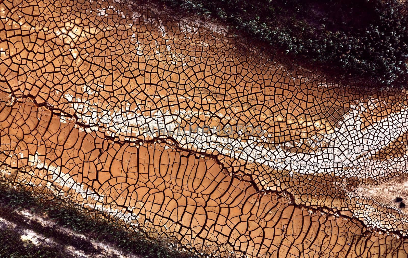 Desert. Aerial view of a beautiful cracks in the ground. texture, deep crack. Effects of heat and drought. effects of global warming. cracked desert landscape. by EvgeniyQW