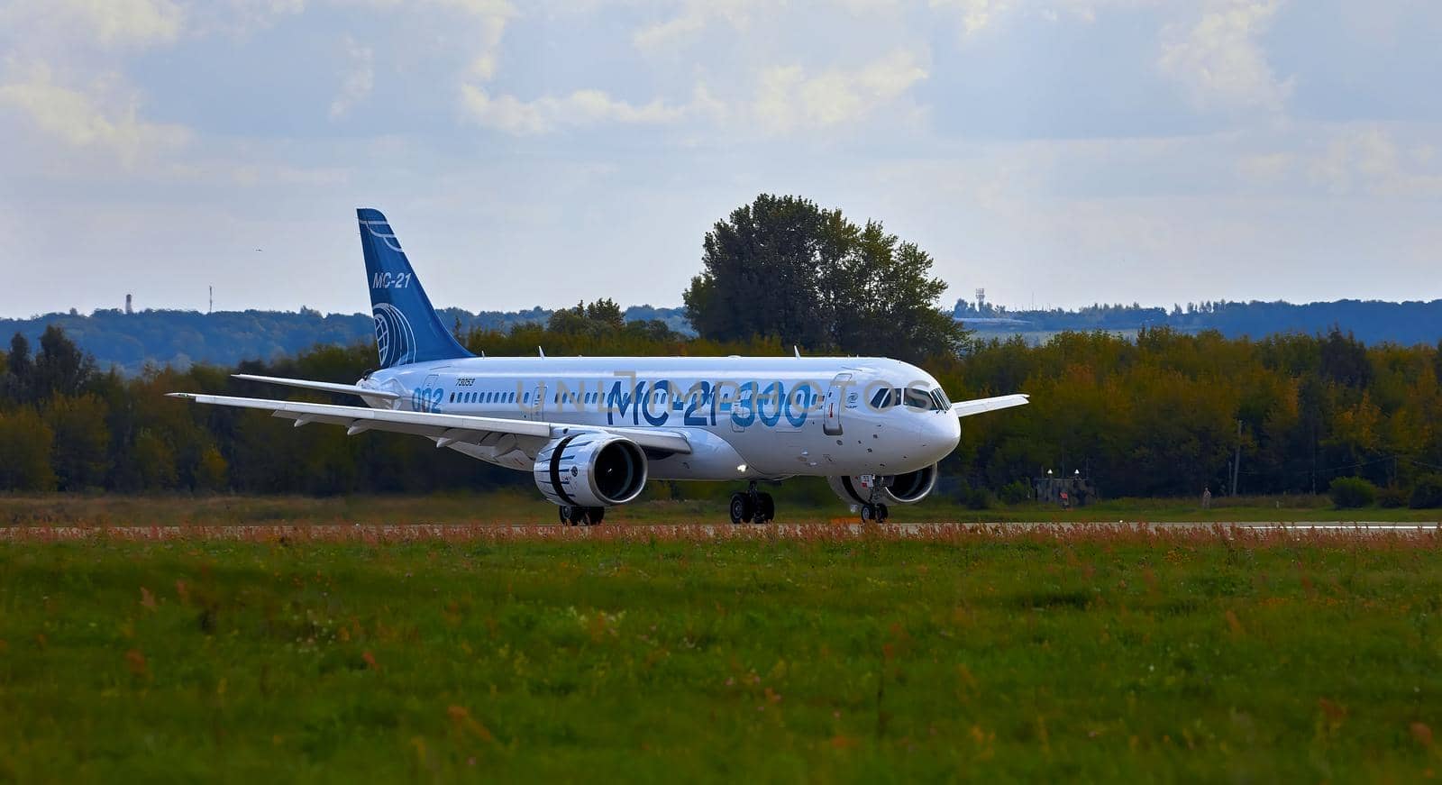 New Russian passenger aircraft MS-21-300 flying prototype of a new Russian civil airliner during test flights on MAKS 2019 airshow. ZHUKOVSKY, RUSSIA, AUGUST 27, 2019 by EvgeniyQW