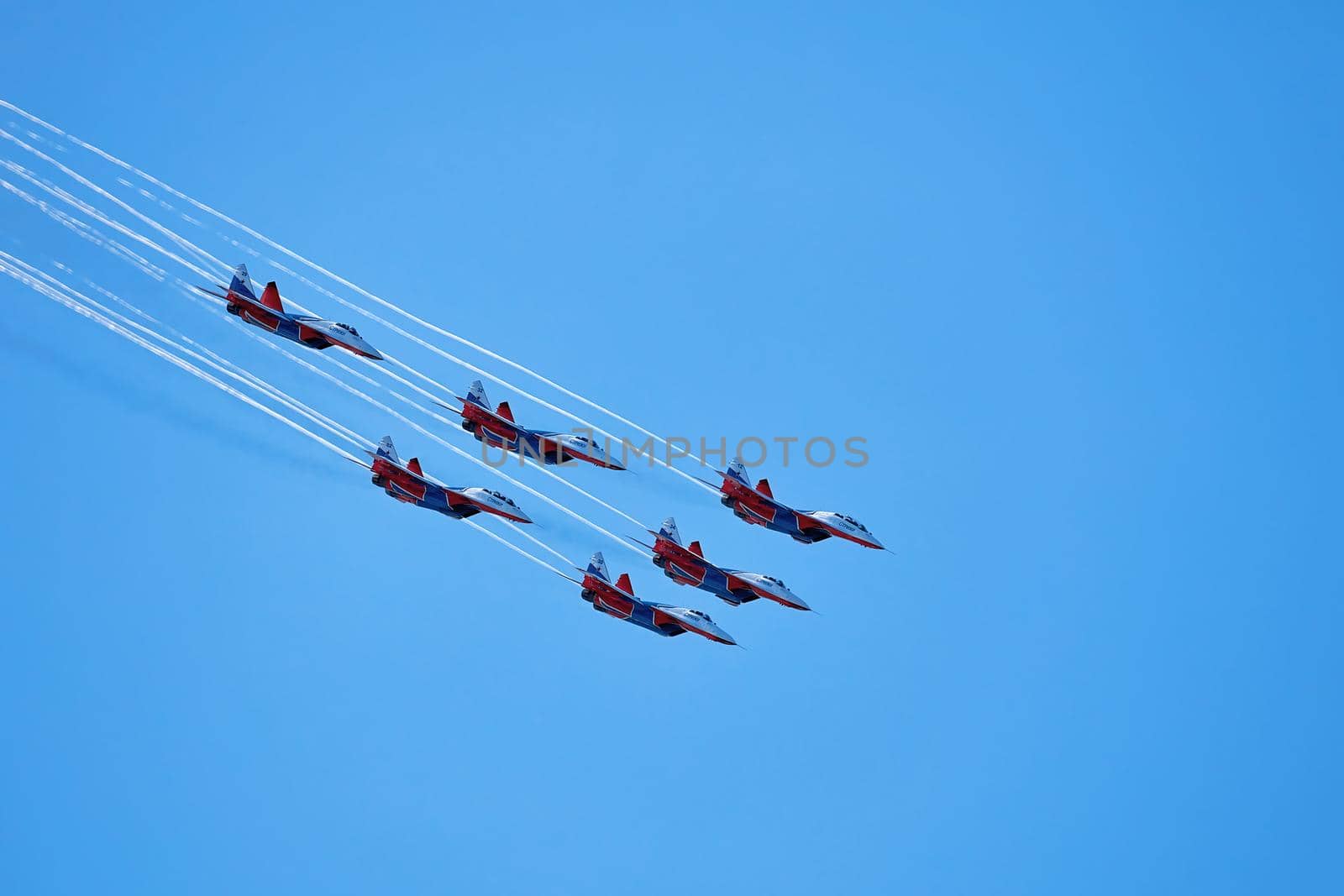 Airshow of the aerobatic team Strizhi (The Swifts). Aerobatic Team on fighters Mig-29, Russian Air Force, on at the International Aviation and Space salon MAKS 2019. ZHUKOVSKY, RUSSIA, 08,27,2019.