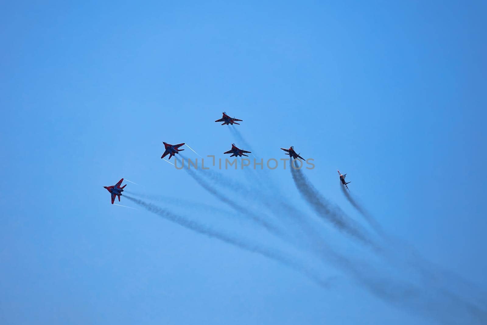 Airshow of the aerobatic team Strizhi - The Swifts. Aerobatic Team on fighters Mig-29, Russian Air Force, on at the International Aviation and Space salon MAKS 2019. ZHUKOVSKY, RUSSIA, 08,27,2019 by EvgeniyQW