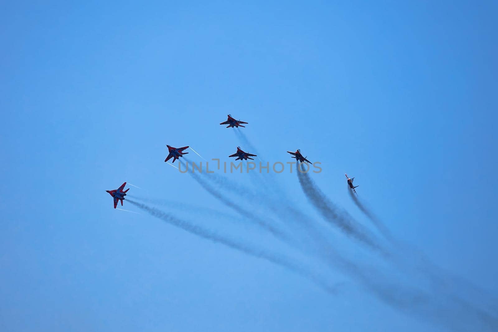 Airshow of the aerobatic team Strizhi (The Swifts). Aerobatic Team on fighters Mig-29, Russian Air Force, on at the International Aviation and Space salon MAKS 2019. ZHUKOVSKY, RUSSIA, 08,27,2019.