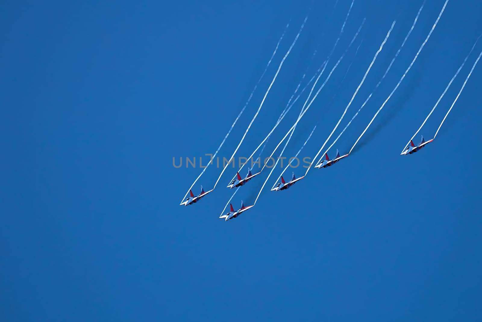 Airshow of the aerobatic team Strizhi - The Swifts. Aerobatic Team on fighters Mig-29, Russian Air Force, on at the International Aviation and Space salon MAKS 2019. ZHUKOVSKY, RUSSIA, 08,27,2019 by EvgeniyQW