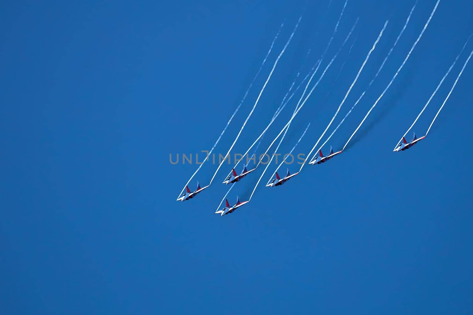 Airshow of the aerobatic team Strizhi (The Swifts). Aerobatic Team on fighters Mig-29, Russian Air Force, on at the International Aviation and Space salon MAKS 2019. ZHUKOVSKY, RUSSIA, 08,27,2019.