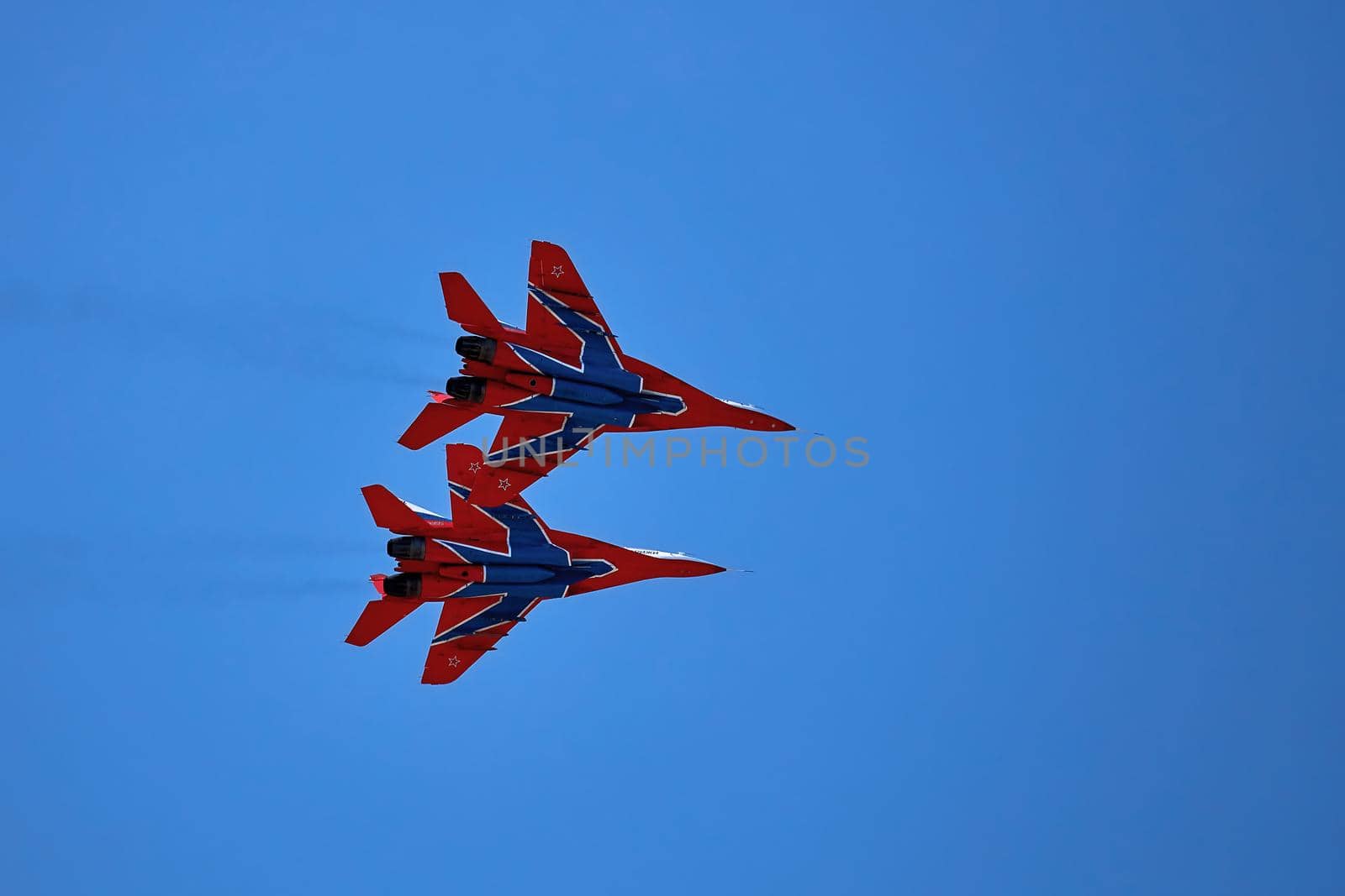 Airshow of the aerobatic team Strizhi - The Swifts. Aerobatic Team on fighters Mig-29, Russian Air Force, on at the International Aviation and Space salon MAKS 2019. ZHUKOVSKY, RUSSIA, 08,27,2019 by EvgeniyQW