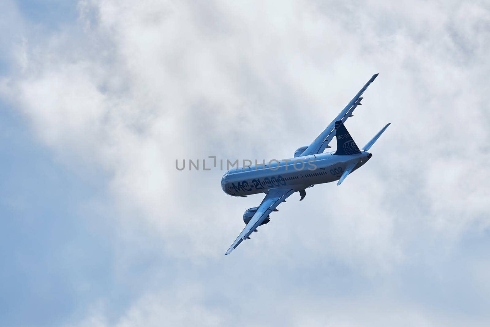 New Russian passenger aircraft MS-21-300 flying prototype of a new Russian civil airliner during test flights on MAKS 2019 airshow. ZHUKOVSKY, RUSSIA, AUGUST 27, 2019 by EvgeniyQW