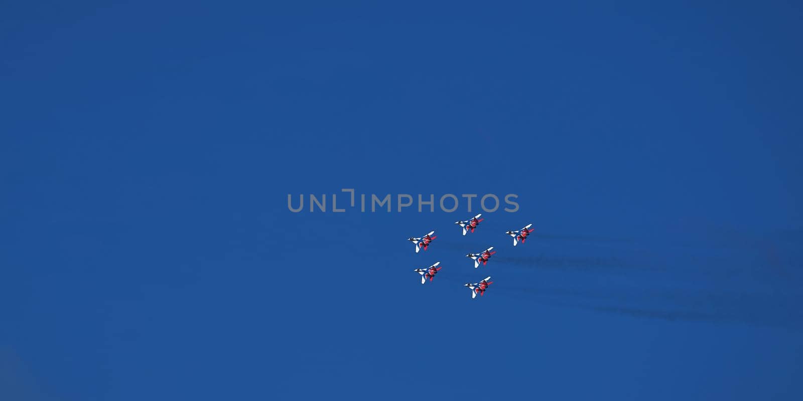 Airshow of the aerobatic team Strizhi (The Swifts). Aerobatic Team on fighters Mig-29, Russian Air Force, on at the International Aviation and Space salon MAKS 2019. ZHUKOVSKY, RUSSIA, 08,27,2019.