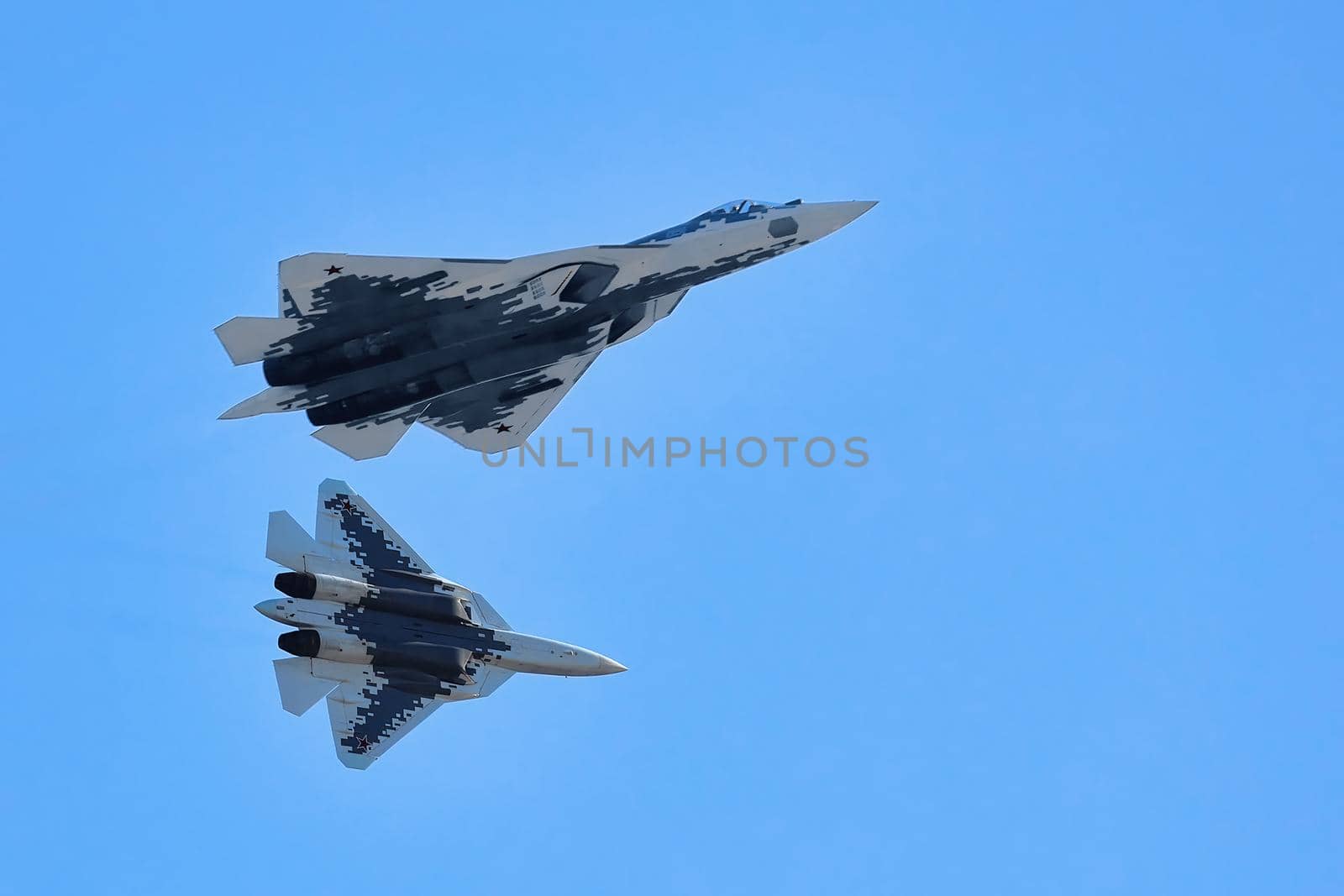 New Russian five generation's fighters SU 57, T-50 shows aerial maneuver battle at Moscow International Aviation and Space Salon MAKS 2019. RUSSIA, AUGUST 28, 2019 by EvgeniyQW